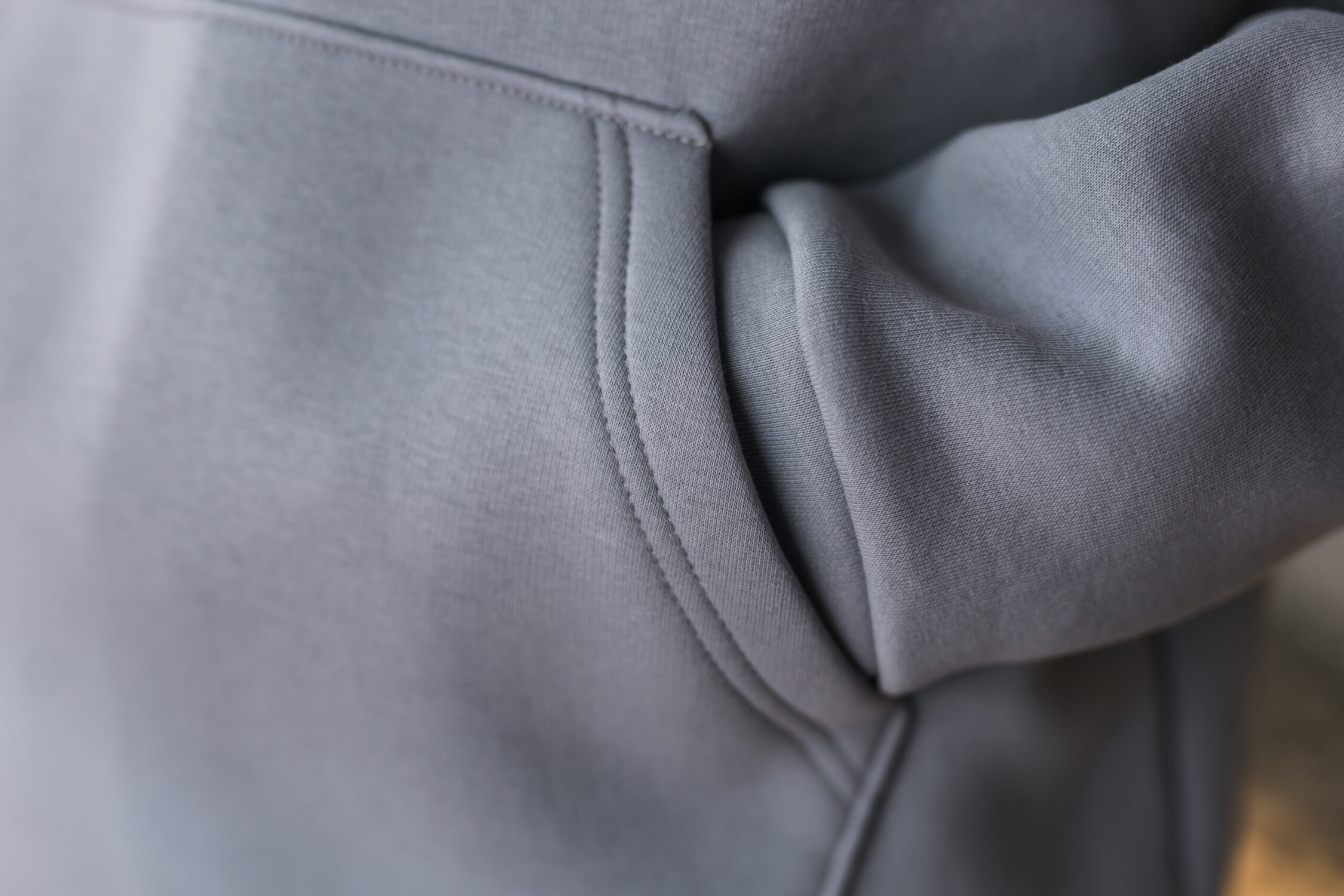 Hoodie texture. Close-up shot of sweatshirt hoodie brown textile warm fabric macro background.